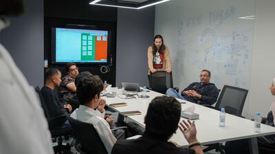 Senior designer Ahmad Zabarah leads a meeting with gaming developers at Steer Studios. Photo: Steer Studios