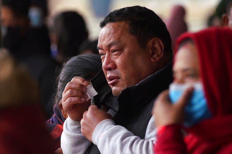 Tears at a hospital in Pokhara, Nepal, as a relative waits to receive the body of a victim of the Yeti Airlines plane crash. AP