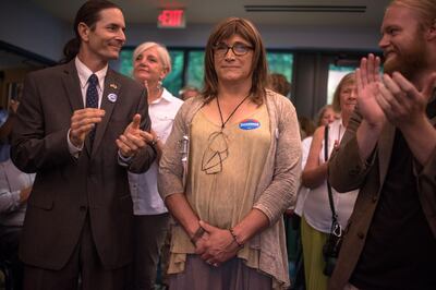 BURLINGTON, VT - AUGUST 15: Vermont Democratic gubernatorial nominee Christine Hallquis (C) listens to speakers at a Vermont Democratic Unity Rally on August 15, 2018 in Burlington, Vermont. Hallquist, the first openly transgender person to win a major party nomination for governor, will face off against Republican incumbent Governor Phil Scott in this year's general election.   Hillary Swift/Getty Images/AFP
== FOR NEWSPAPERS, INTERNET, TELCOS & TELEVISION USE ONLY ==
