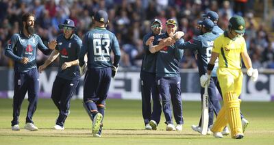 England players celebrate after taking the wicket of Australia's D'Arcy Short during the One Day International match at the SSE SWALEC Stadium, Cardiff, Saturday June 16, 2018. (Nigel French/PA via AP)
