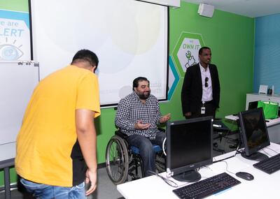DUBAI, UNITED ARAB EMIRATES. 11 SEPTEMBER 2019. Mohammad Zeeshan joins his team in a training session at Tanfeeth.Hiring people with disabilities - Emirates NBD has set up a Careers Network in which they have placed close to 70 people with disabilities in different sectors from banking to the hotels. We meet two staffers with disabilities and their employer. This is ahead of a meet-up next week the bank has set where they will link employers with people with disabilities in Dubai (Photo: Reem Mohammed/The National)Reporter:Section: