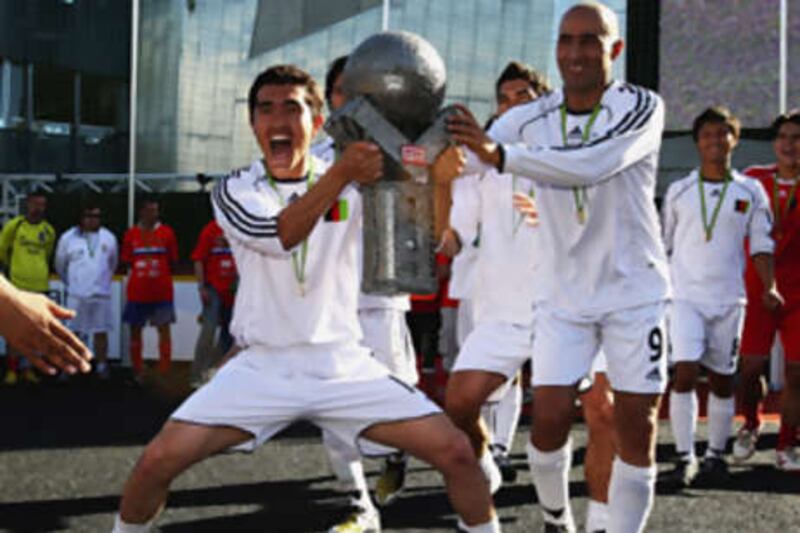 The team from Afghanistan celebrate their win over Russia during the final of the 2008 Homeless World Cup in Federation Square, Melbourne.