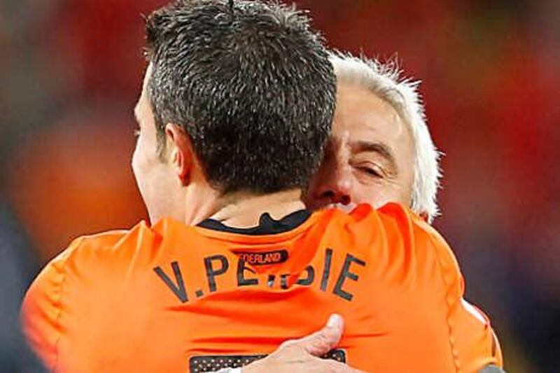 Bert van Marwijk, the Holland coach, congratulates Robin van Persie after the Dutch beat Uruguay on Tuesdaynight to book their place in the 2010 World Cup final.