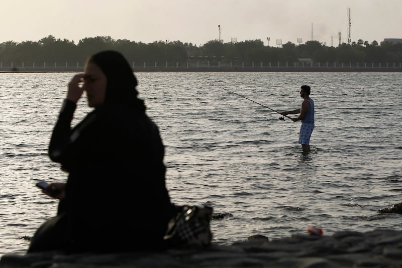 A man fishes along a beach overlooking the Red Sea by Jeddah on June 10, 2011. Reuters