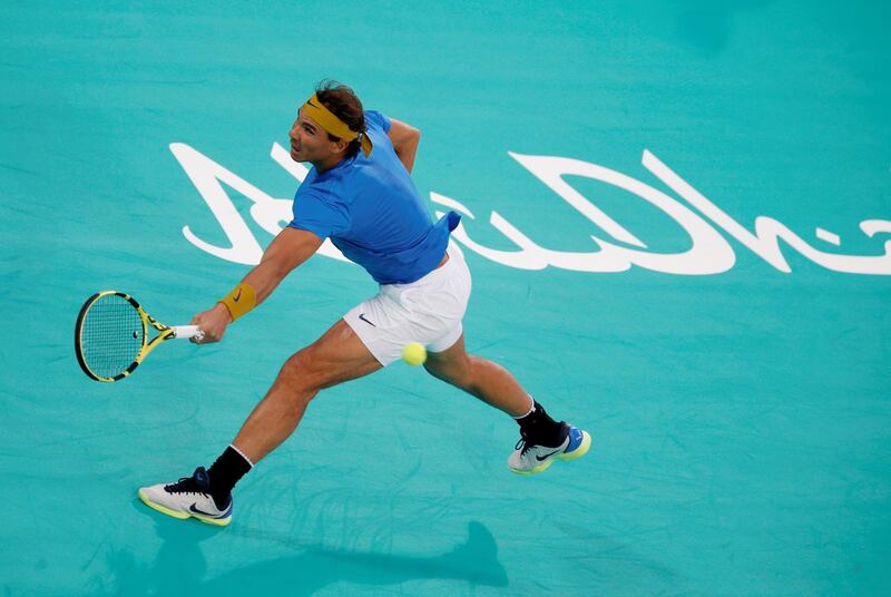 Rafael Nadal returns a ball to Kevin Anderson during their Mubadala World Tennis Championship semi-final in Abu Dhabi. EPA