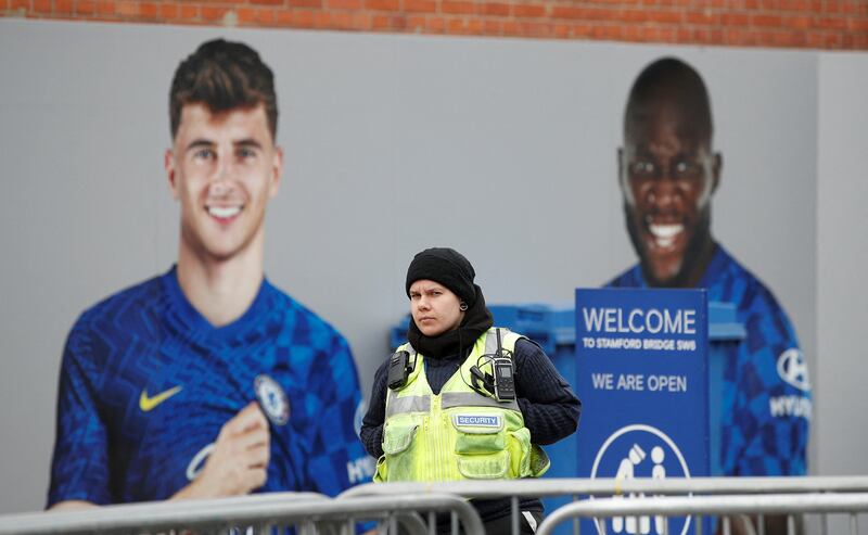 A member of Chelsea Football Club's security staff walks at the entrance to Stamford Bridge, following Britain's imposing of sanctions on the club's Russian owner, Roman Abramovich. Reuters