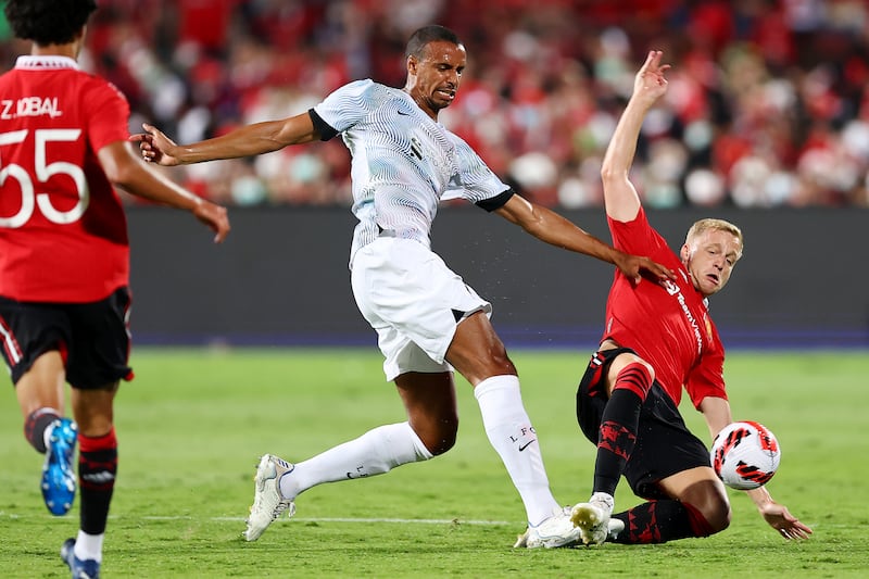 Joel Matip of Liverpool and Donny van de Beek of Manchester United.  Getty