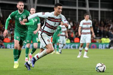 Portugal's striker Cristiano Ronaldo chases the ball during the FIFA World Cup Qatar 2022 qualifying round Group A football match between Ireland and Portugal at the Aviva Stadium in Dublin on November 11, 2021.  - The match ended 0-0.  (Photo by PAUL FAITH  /  AFP)