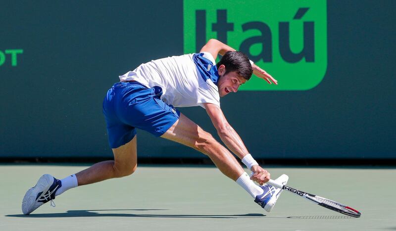 epa06625277 Novak Djokovic of Serbia in action against Benoit Paire of France during a second round match at the Miami Open tennis tournament on Key Biscayne, Miami, Florida, USA, 23 March 2018.  EPA/ERIK S. LESSER