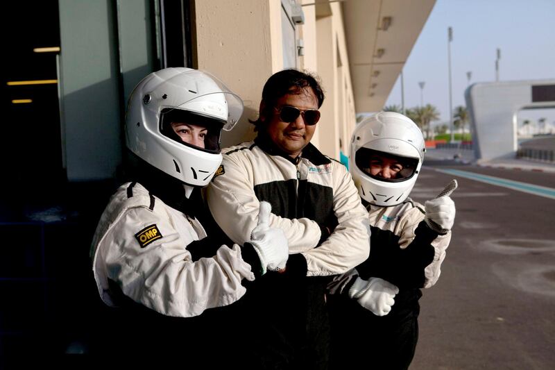 Abu Dhabi, United Arab Emirates, May 27, 2013:    People wait for their turn to ride in a Supersport SST while taking part in a passenger hot-lap experience during a corporate open day at the Yas Marina Circuit in Abu Dhabi on May 27, 2013. Christopher Pike / The National\

