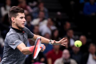 Austria's Dominic Thiem returns the ball to Russia's Karen Khachanov during their men's singles semi-final tennis match on day six of the ATP World Tour Masters 1000 - Rolex Paris Masters - indoor tennis tournament at The AccorHotels Arena in Paris, on November 3, 2018. / AFP / Anne-Christine POUJOULAT            
