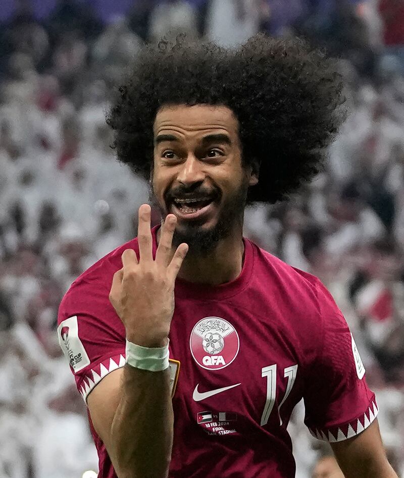 Qatar's Akram Afif celebrates after scoring his hat-trick. AP 