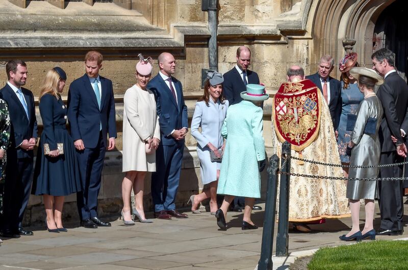 Members of the royal family greet Queen Elizabeth II as she arrives for the Easter Sunday service at St George's Chapel in Windsor, England. Getty Images