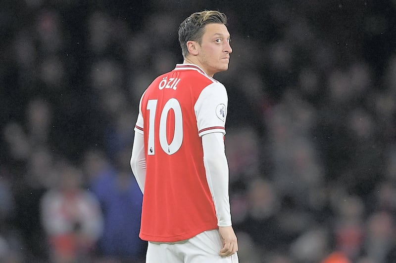 Arsenal's German midfielder Mesut Ozil looks on during the English Premier League football match between Arsenal and Southampton at the Emirates Stadium in London on November 23, 2019. (Photo by Daniel LEAL-OLIVAS / AFP) / RESTRICTED TO EDITORIAL USE. No use with unauthorized audio, video, data, fixture lists, club/league logos or 'live' services. Online in-match use limited to 120 images. An additional 40 images may be used in extra time. No video emulation. Social media in-match use limited to 120 images. An additional 40 images may be used in extra time. No use in betting publications, games or single club/league/player publications. / 