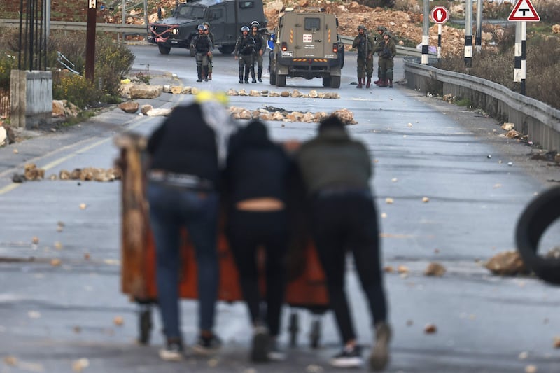 Palestinian demonstrators confront Israeli security forces outside Ramallah, near the Israeli settlement of Beit El. AFP