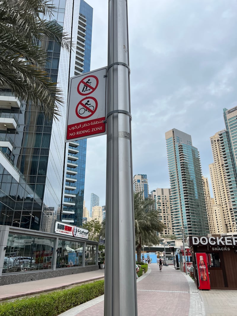 In this roughly 500 metre section from Marina Mall to the yacht wharf it is prohibited to cycle or use an e-scooter. Rory Reynolds / The National