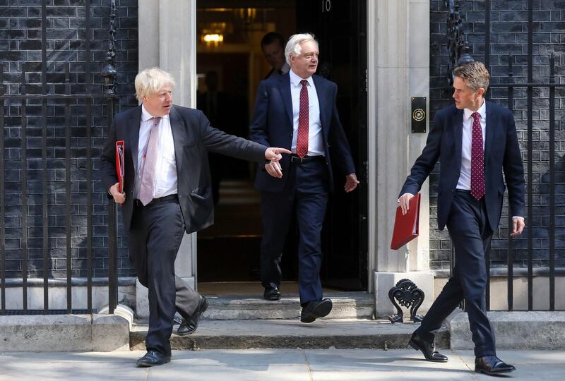 FILE: Boris Johnson, U.K. foreign secretary, left, David Davis, U.K. exiting the European Union (EU) secretary, centre, and Gavin Williamson, U.K. defence secretary, leave after attending a meeting of cabinet minsters at number 10 Downing Street in London, U.K., on Tuesday, July 3, 2018. U.K. Prime Minister Theresa May was plunged into a crisis after Brexit Secretary David Davis and his deputy resigned over her plans to keep close ties to the European Union after the divorce. The man who is going to inherit one of the toughest jobs in the U.K. -- negotiating Brexit -- is a 44-year-old former Foreign Office lawyer who entered Parliament in 2010: Dominic Raab. Our editors select the best archive images of Raab and Davis. Photographer: Chris Ratcliffe/Bloomberg