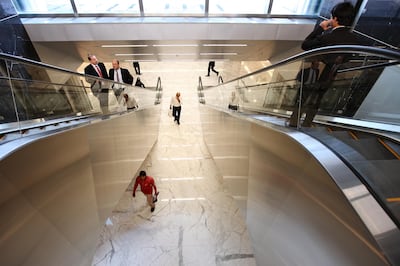 Dubai, Jan 16th, 2012 --  DIFC STOCK -  Business people on escalators at DIFC. Photo by: Sarah Dea/ The National