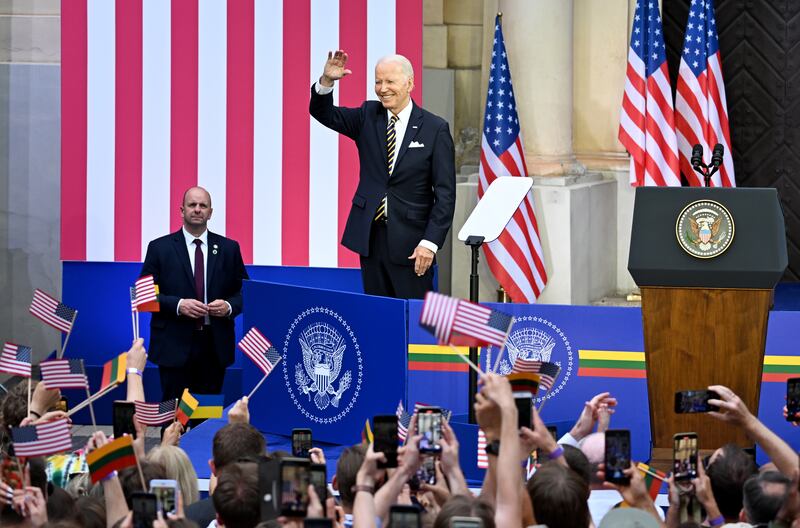 US President Joe Biden greets the audience as he delivers a speech at Vilnius University during the Nato summit. EPA