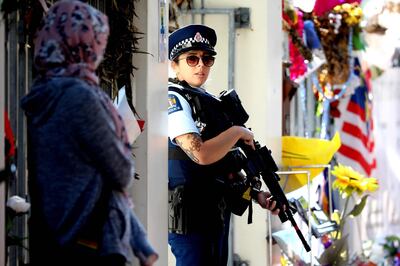 An armed police officer stands guard outside the Al Noor mosque during Friday prayers in Christchurch on May 3, 2019, ahead of the holy month of Ramadan. The death toll from the Christchurch mosque attacks has risen to 51 after a 46-year-old Turkish man succumbed to injuries sustained in the March 15 shootings, the New Zealand prime minister said on May 3. / AFP / Sanka VIDANAGAMA
