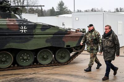 Defence Minister Boris Pistorius, right, with a Marder fighting vehicle of the type being sent to Ukraine. AFP