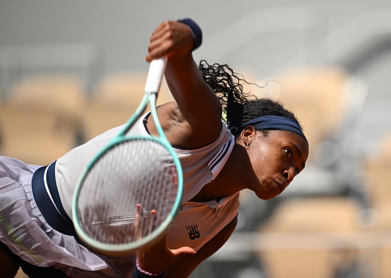 Coco Gauff serves against Ons Jabeur. Getty Images