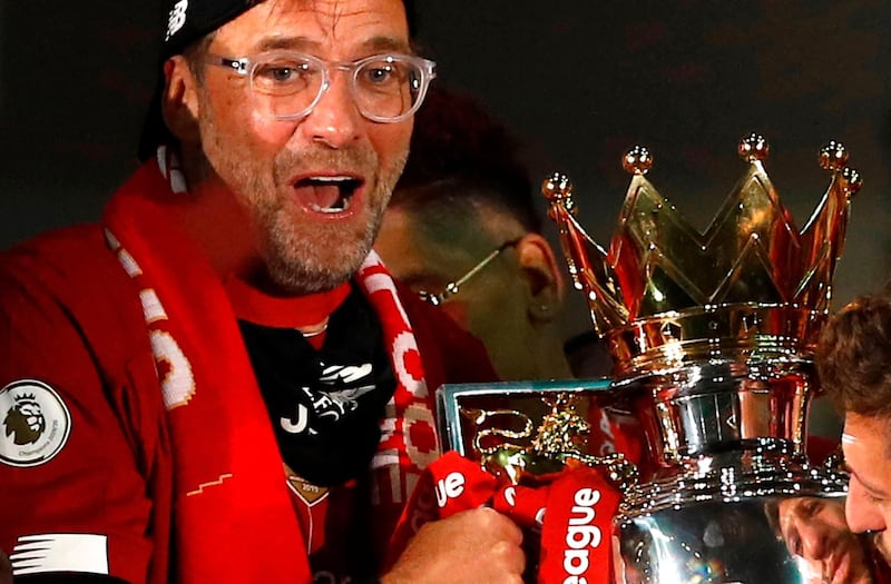 Liverpool manager Jurgen Klopp poses with the Premier League trophy. AFP