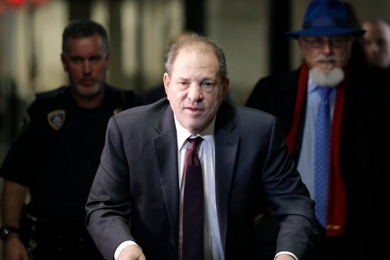 FILE - In this Feb. 20, 2020 file photo, Harvey Weinstein arrives at a Manhattan courthouse for his rape trial in New York.  Weinstein was sentenced Wednesday, March 11,  to 23 years in prison for rape and sexual assault.  (AP Photo/Seth Wenig, File)