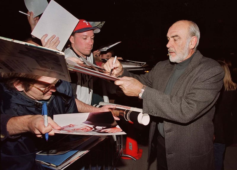 Actor Sean Connery, one of the stars of the film " Playing By Heart," signs autographs for fans at the film's premiere December 11 in Los Angeles. Connery and actress Gena Rowlands portray a couple in the film whose long and comfortable marriage is suddenly threatened by surprises from within and without.

FSP/SV/CLH/