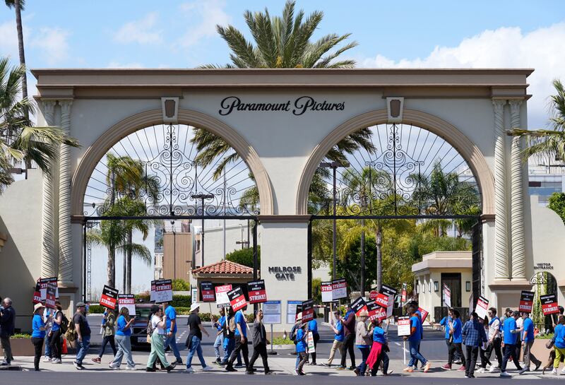Striking writers rally in front of the entrance to the Paramount Pictures studio in Los Angeles. AP