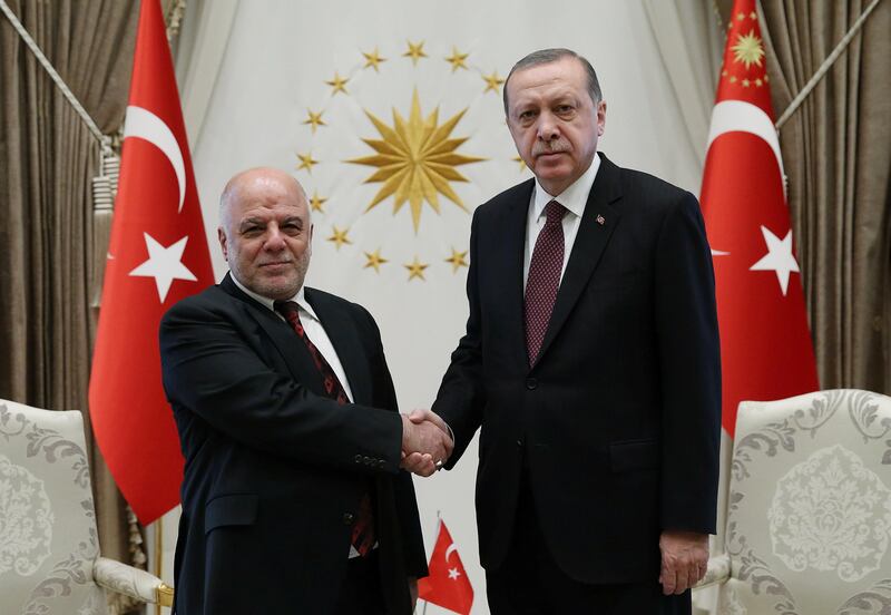Turkish President Tayyip Erdogan meets with Iraq's Prime Minister Haider al-Abadi at the Presidential Palace in Ankara, Turkey, October 25, 2017. Murat Cetinmuhurdar/Presidential Palace/Handout via REUTERS ATTENTION EDITORS - THIS PICTURE WAS PROVIDED BY A THIRD PARTY. NO RESALES. NO ARCHIVE.