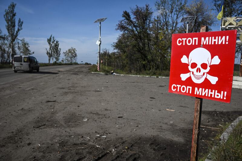 A sign warns of landmines in Izyum, eastern Ukraine. AFP