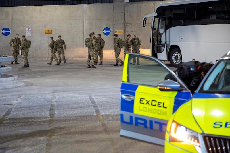 Soldiers from 1 Royal Anglian Regiment arrive at the Excel Centre to build the new NHS Nightingale Hospital. Courtesy Reuters