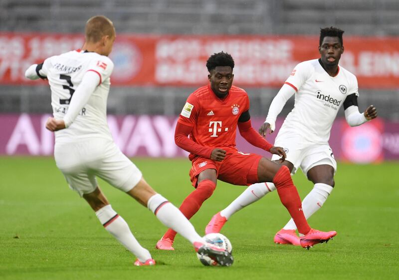 Bayern Munich's Alphonso Davies, closes down Eintracht Frankfurt's Stefan Ilsanker. AP