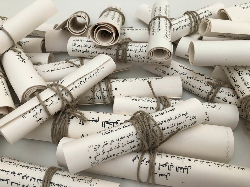 Manal AlDowayan makes porcelain scrolls out of an Abbasid-era text of jurisprudence that her father had in his library, frustrating the viewer's desire for total knowledge of the work.