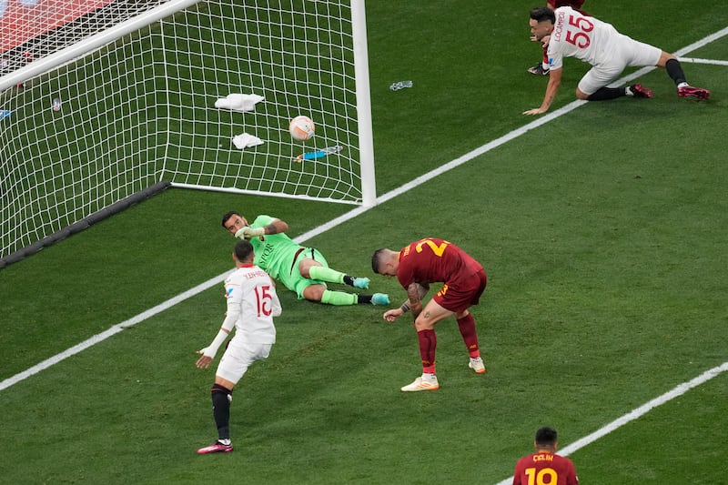 Roma's Gianluca Mancini, centre, reacts after scoring an own goal. AP 