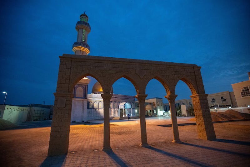 Worshippers arrive on the first morning of Eid Al Adha at Bani Hashim Mosque in Abu Dhabi. Victor Besa / The National