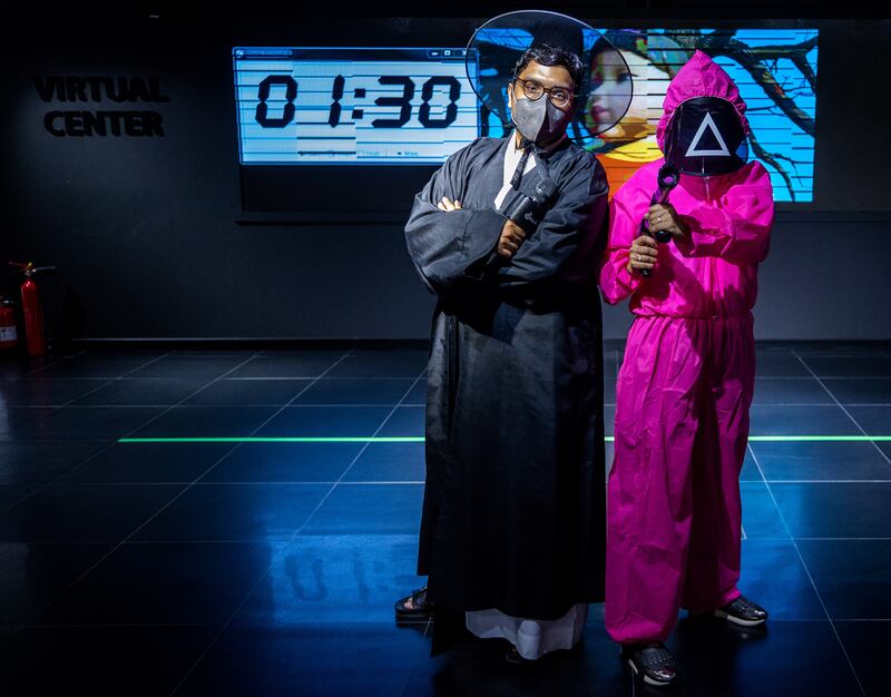 Mohamed as The Front Man, left, with a guard during the Squid Game event at the Korean Cultural Centre at twofour54 in Abu Dhabi. All Photos: Victor Besa / The National
