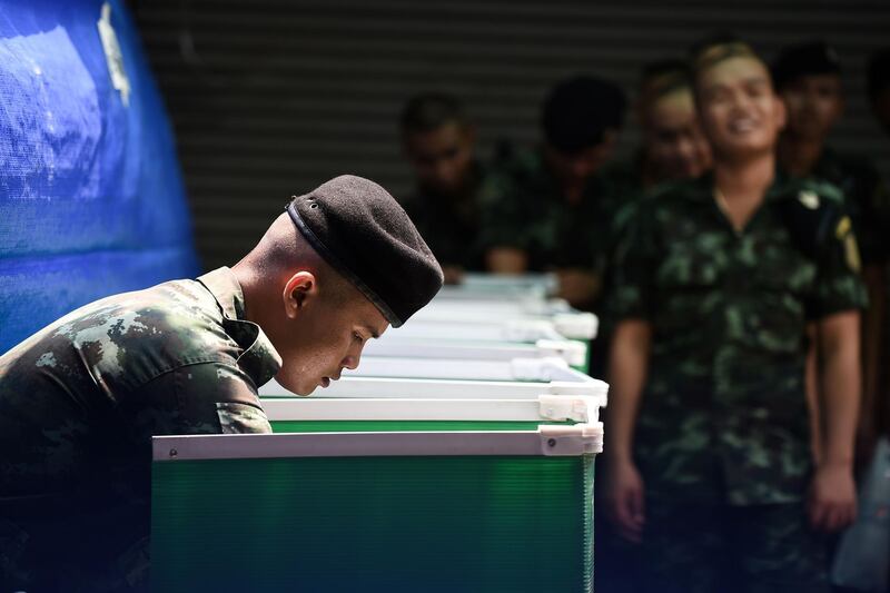 Royal Thai soldiers cast their ballots at a polling station in Bangkok. AFP