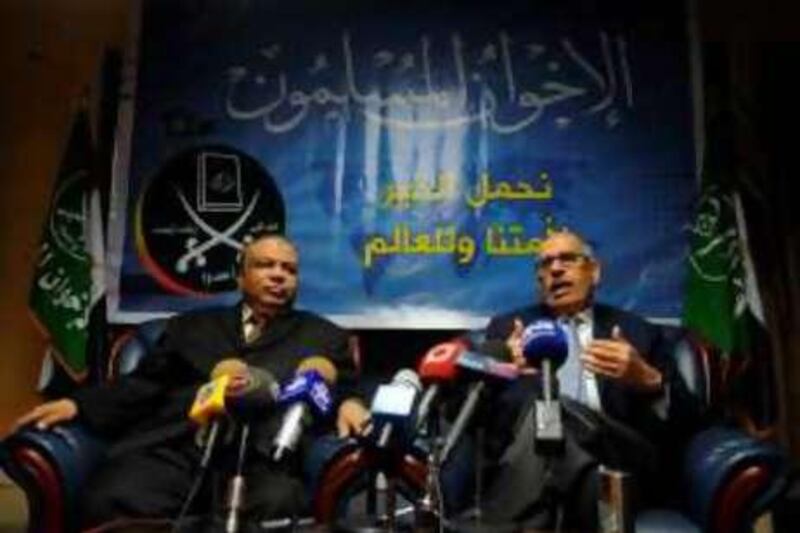 Egyptian Nobel Peace laureate and former UN atomic watchdog chief Mohamed ElBaradei (R) talks to the media during a joint press conference with Saad al-Katatni, the parliamentary leader of Egypt's largest opposition force, the Muslim Brotherhood, after their meeting in Cairo on June 5, 2010. AFP PHOTO/MOHAMED KHALIL *** Local Caption ***  689607-01-08.jpg