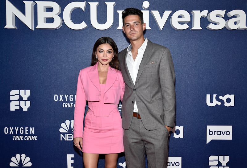 Sarah Hyland, left, and Wells Adams married in an outdoor ceremony in California on August 20. Invision / AP