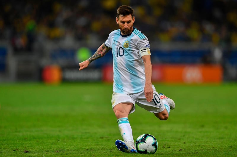 (FILES) In this file photo taken on July 02, 2019, Argentina's Lionel Messi strikes the ball during the Copa America football tournament semi-final match against Brazil at the Mineirao Stadium in Belo Horizonte, Brazil.  Messi will once again hold the baton for Argentina on its way to the World Cup Qatar 2022 football tournament, in the debut of the South American Qualification Round with Ecuador, a team that is usually a box of surprises. / AFP / Pedro UGARTE
