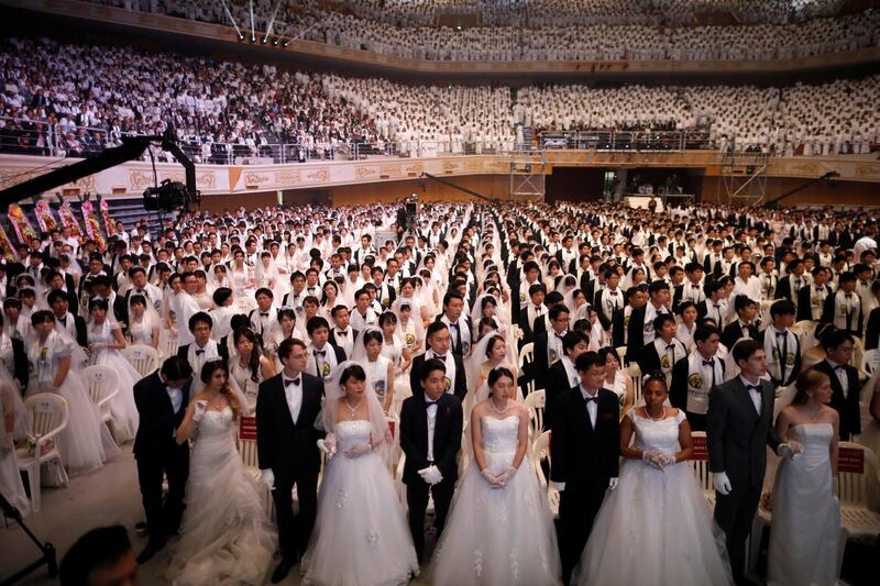 Couples attend a mass wedding ceremony of the Unification Church at Cheongshim Peace World Centre in Gapyeong, South Korea. Kim Hong-Ji / Reuters
