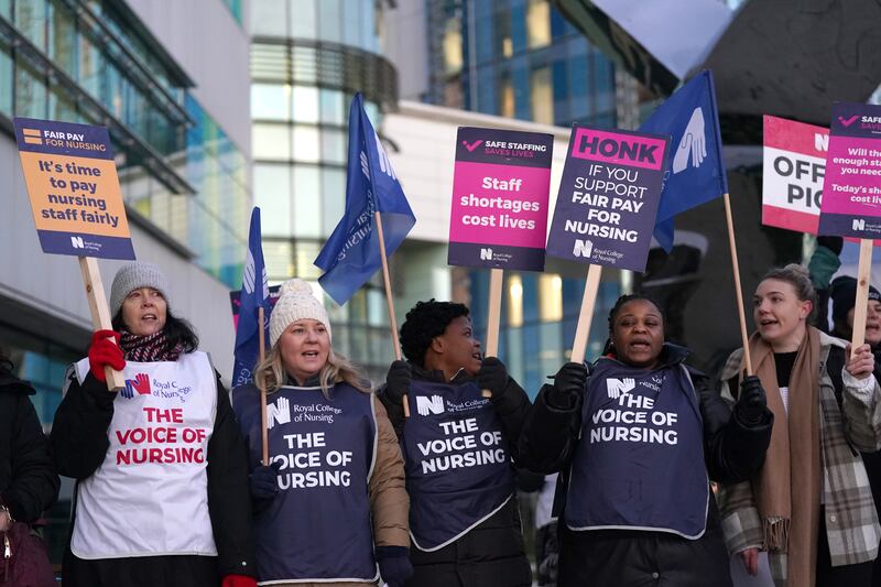 Members of the Royal College of Nursing on the picket line outside Queen Elizabeth Hospital in Birmingham, as nurses in England, Wales and Northern Ireland strike over pay. PA
