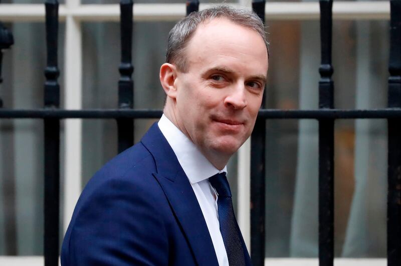 Britain's Foreign Secretary and First Secretary of State Dominic Raab walks along Downing Street in central London on January 30, 2020. / AFP / Tolga AKMEN

