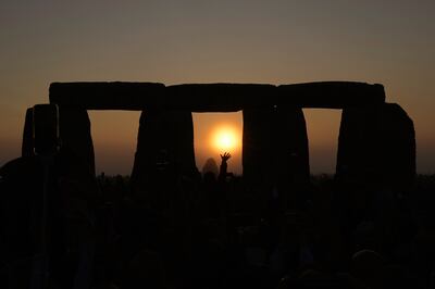Revelers gather at the ancient stone circle Stonehenge to celebrate the Summer Solstice, the longest day of the year, near Salisbury, England, on Wednesday. AP Photo