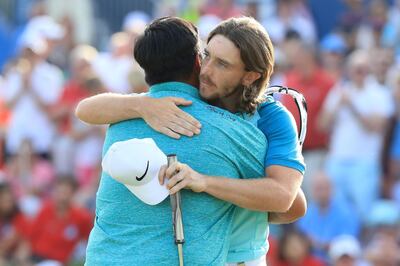 DUBAI, UNITED ARAB EMIRATES - NOVEMBER 19:  Kiradech Aphibarnrat of Thailand embraces Tommy Fleetwood of England on the 18th green during the final round of the DP World Tour Championship at Jumeirah Golf Estates on November 19, 2017 in Dubai, United Arab Emirates.  (Photo by Andrew Redington/Getty Images)