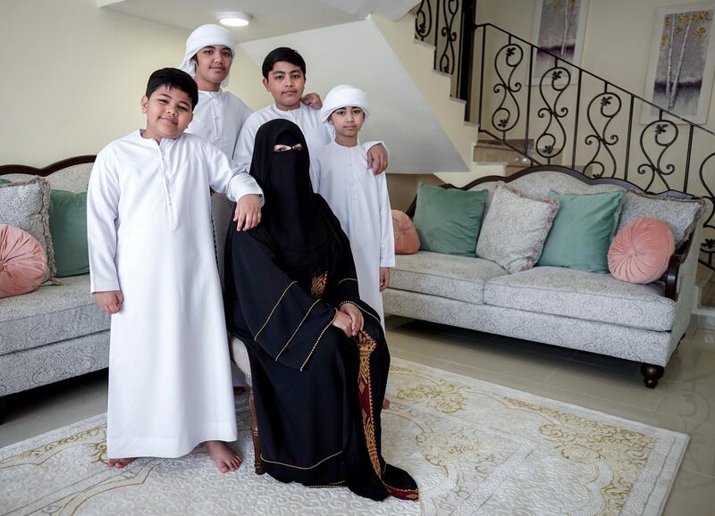 Abu Dhabi, United Arab Emirates, April 30, 2020.   
 Filipino woman, Mona Mohamed Baraguir who donates rice, eggs, cooking oil and other daily essentials to laid off workers.
Mona with her children, (L-R) Fares-9, Hamed Khalifa-15,  Ali-13 and Saed- 11. Victor Besa / The National
Section:  NA
Reporter:  Shireena Al Nuwais