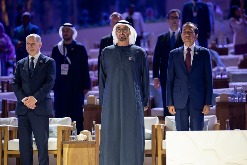 President Sheikh Mohamed with Joko Widodo, President of Indonesia, and German Chancellor Olaf Scholz stand for the national anthem during the Zayed Sustainability Prize for Climate Action, during COP28. All pictures, UAE Presidential Court unless stated.
