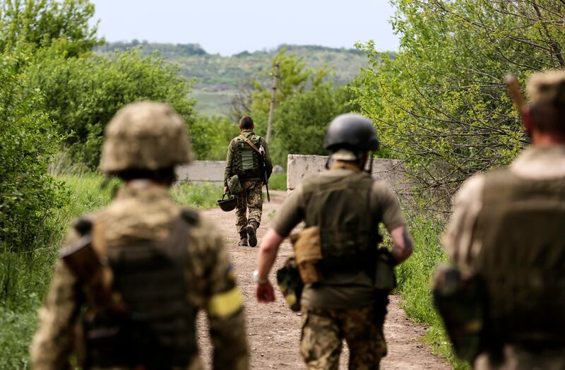 Ukrainian servicemen move to their positions near Zaytseve village, south of Severodonetsk, in the Donetsk region. EPA